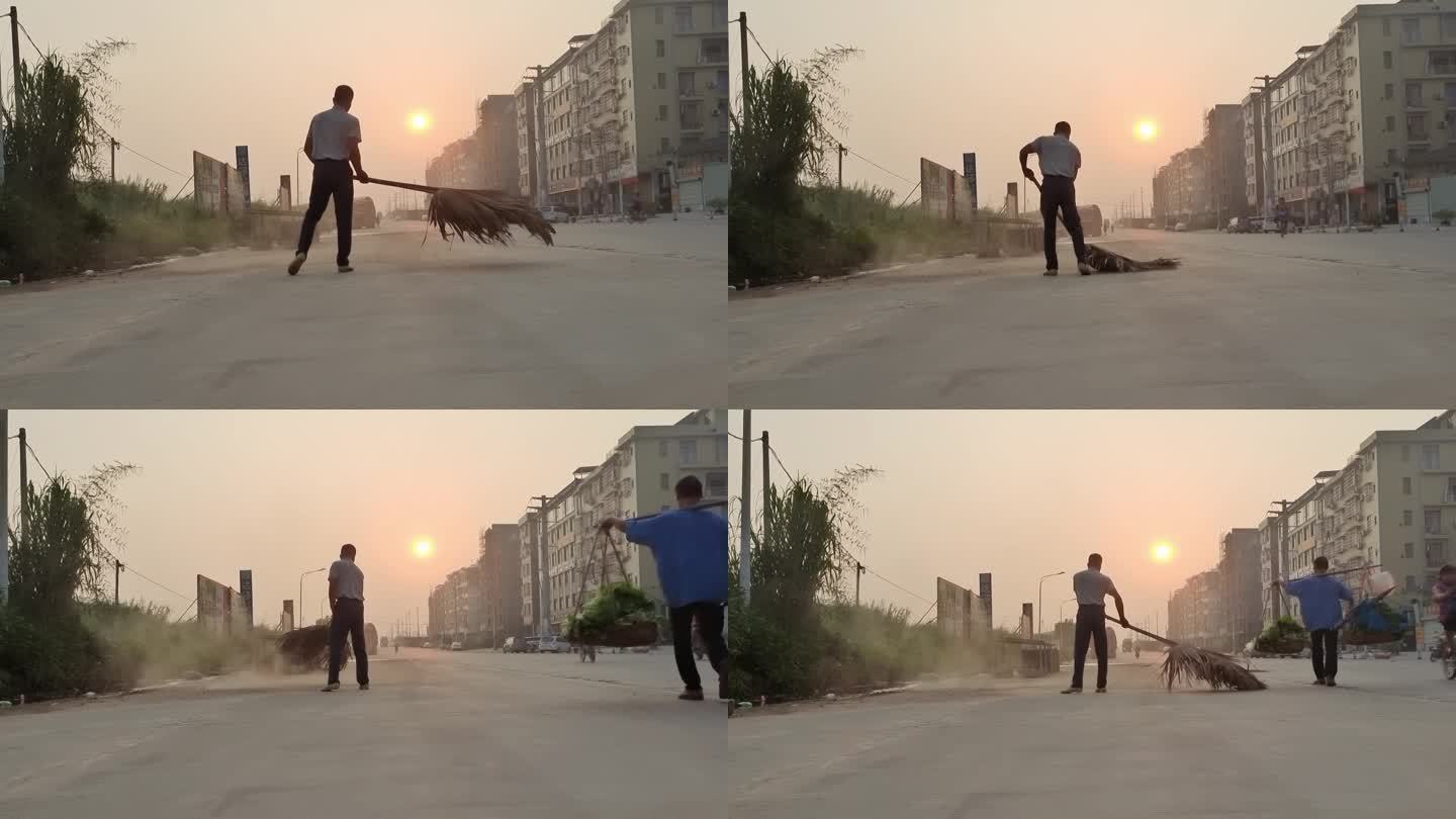 一个男子迎着晨光扫街道清理沙尘搞清洁卫生