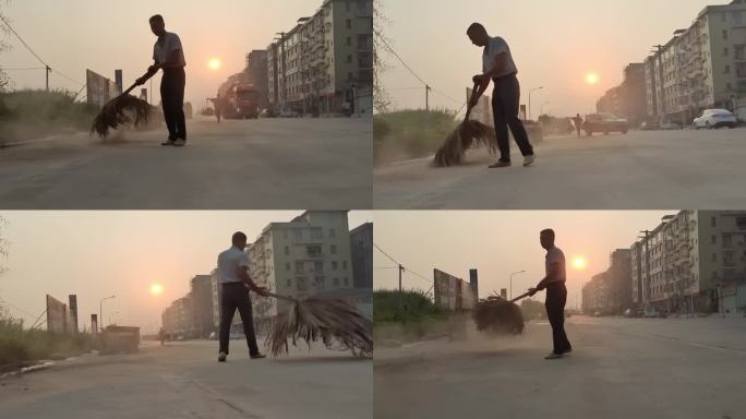 一个扫街的男子 扫街道 清理街道沙尘