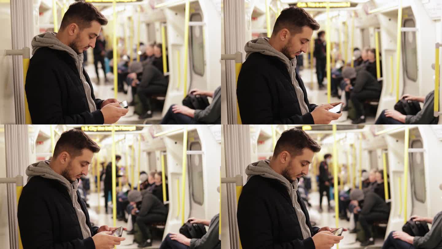 年轻人在地铁里打电话，用智能手机玩游戏，发短信，在手机上浏览社交媒体，用一只手玩游戏，用耳机听音乐
