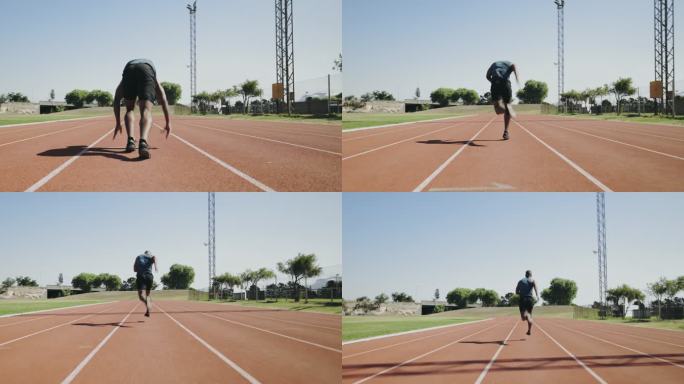 一名年轻男子运动员在体育场的田径跑道上从起始位置跑开的后视图。男子在室外运动场上短跑和训练。积极耐力