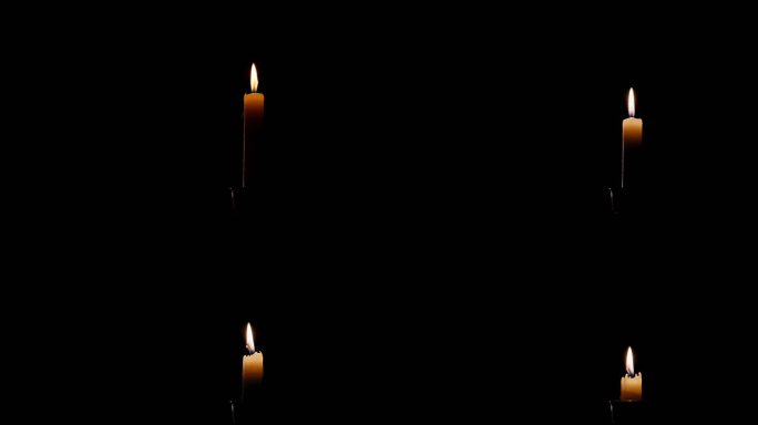 一个点燃的蜡烛火焰在黑色背景上一路燃烧的时间流逝
