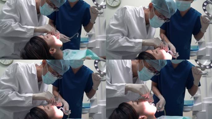 牙科护理-亚洲牙医对患者的牙齿状况进行初步检查