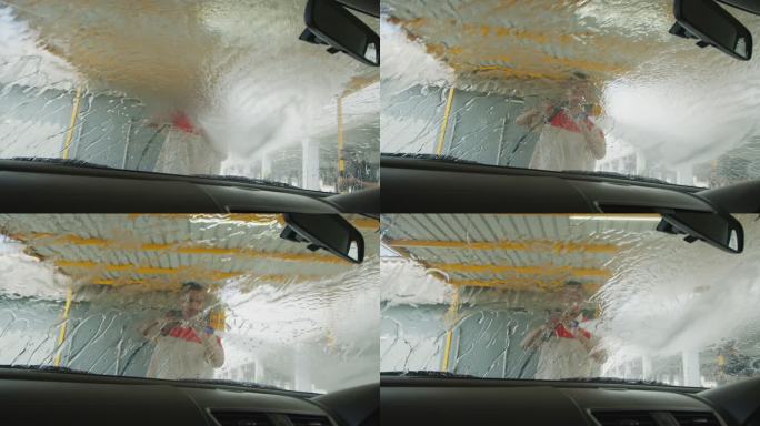 亚洲员工洗车为客户服务。