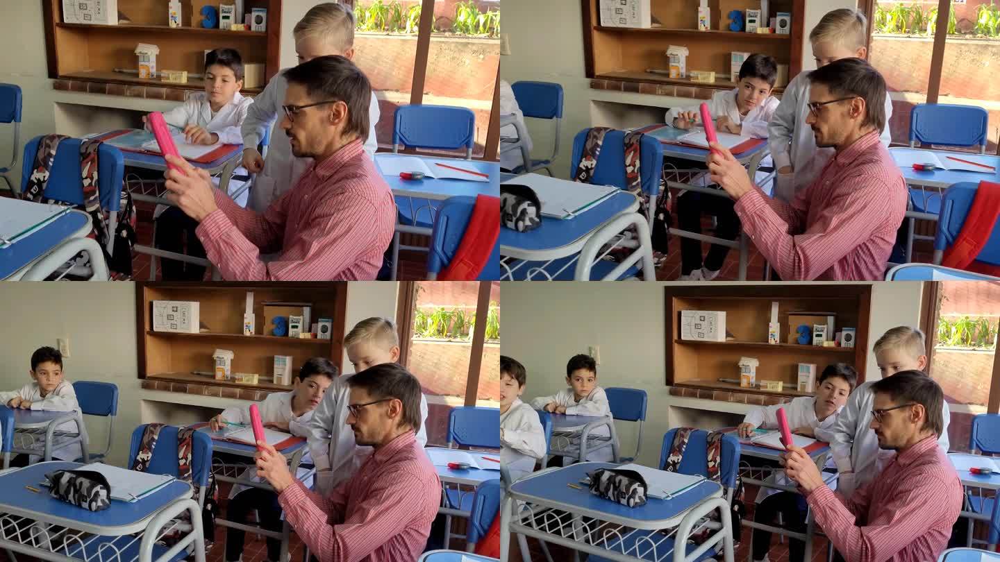 孩子们和老师一起使用数字平板电脑