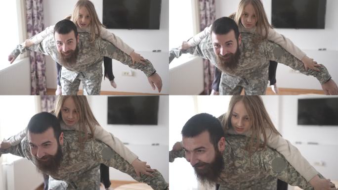 身着军装的父亲从前线回家后与女孩儿玩耍