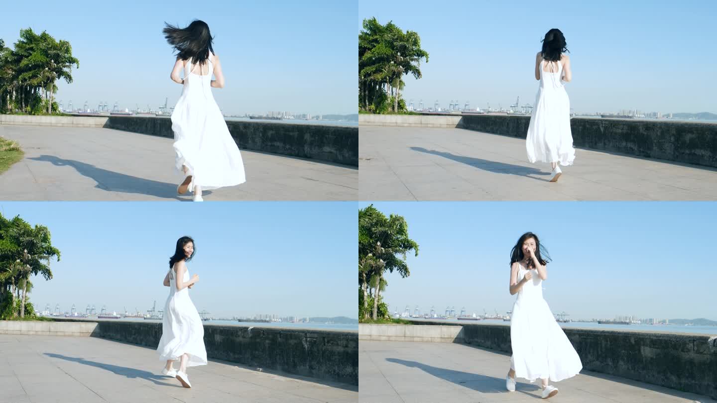 白色长裙女孩在江边奔跑跳舞，裙摆飞扬素材