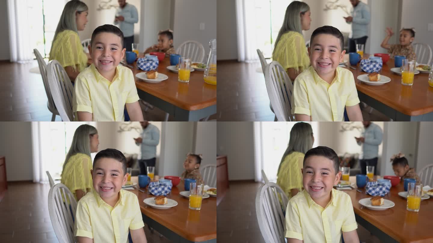 一个可爱的男孩在家吃早饭的肖像