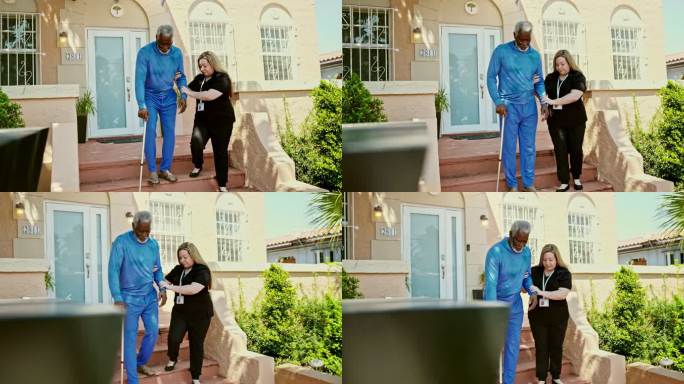 护理人员使用手杖帮助黑人老人