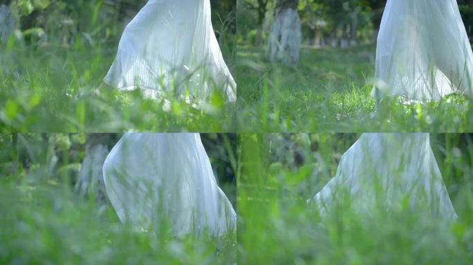 穿白色长裙的女孩在草丛中行走4k视频素材