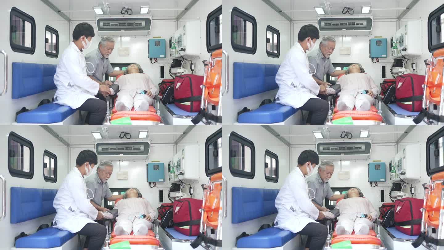 医生在救护车里检查病人。和病人的丈夫一起。
