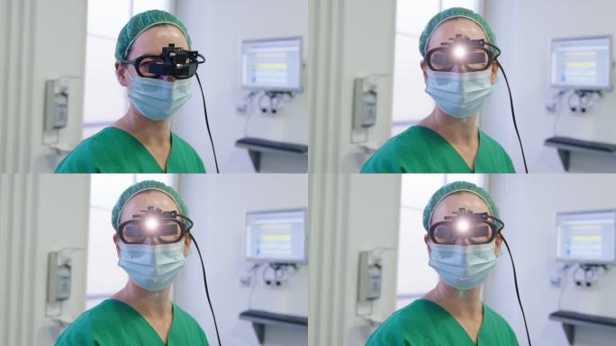 眼科医生戴眼镜手术用医用前照灯的肖像