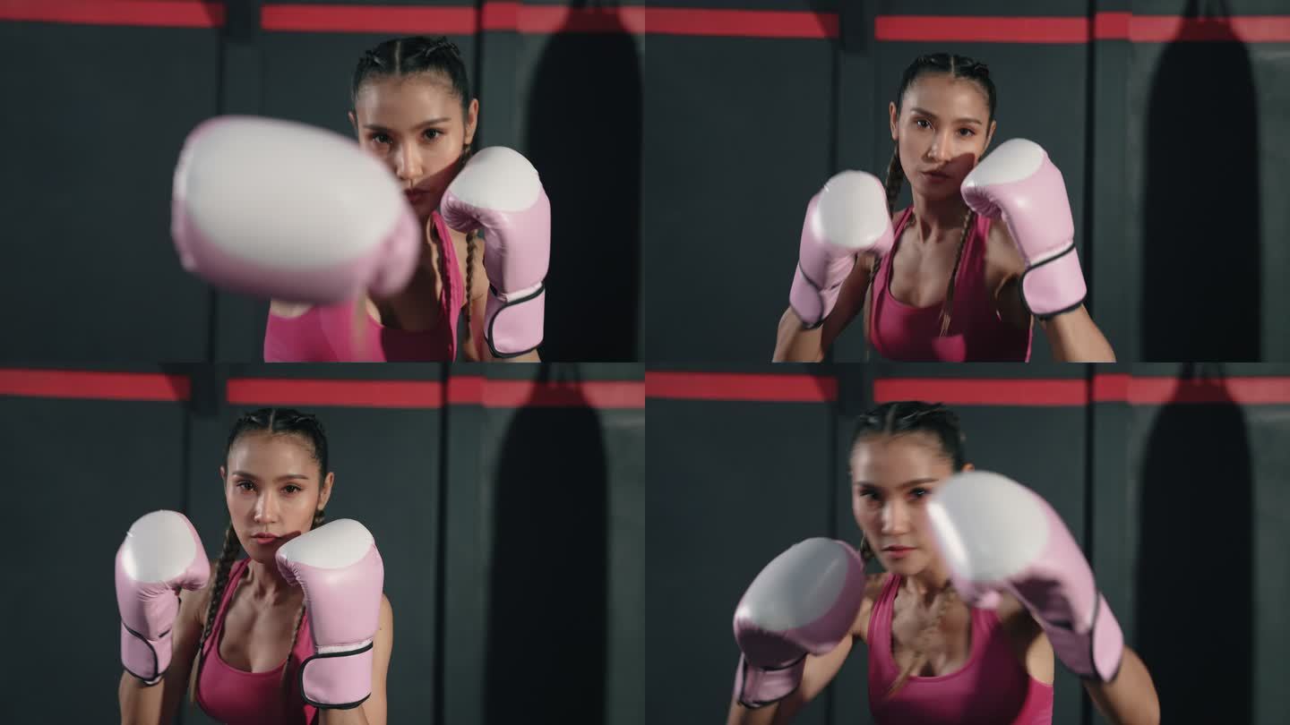 训练拳击动作的年轻亚洲女子。