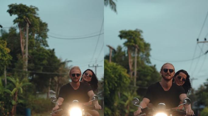骑自行车的情侣情侣摩托车游玩