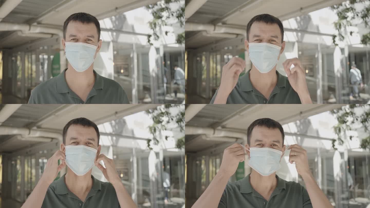 快乐的混合亚洲中年男子摘下医用面罩的肖像，新的正常健康生活方式