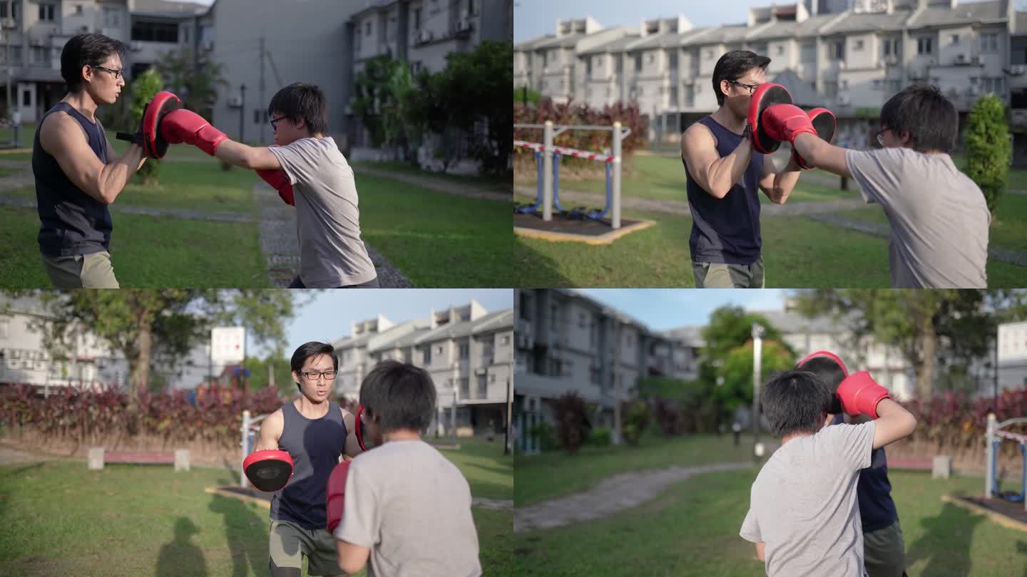 亚裔中国父子在户外后院训练跆拳道。