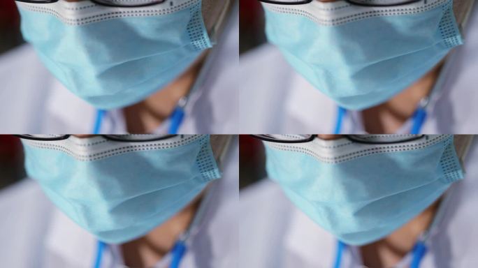戴着一次性医用口罩的医生特写