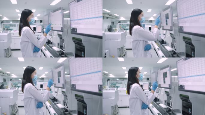 女科学家触摸触摸屏。用计算机设备进行血液检测。