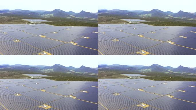 农场上一排排太阳能电池板的高角度4k无人机视频片段