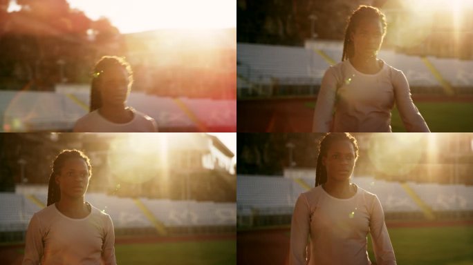 SLO MO日落时在体育场伸展身体的美国黑人女运动员