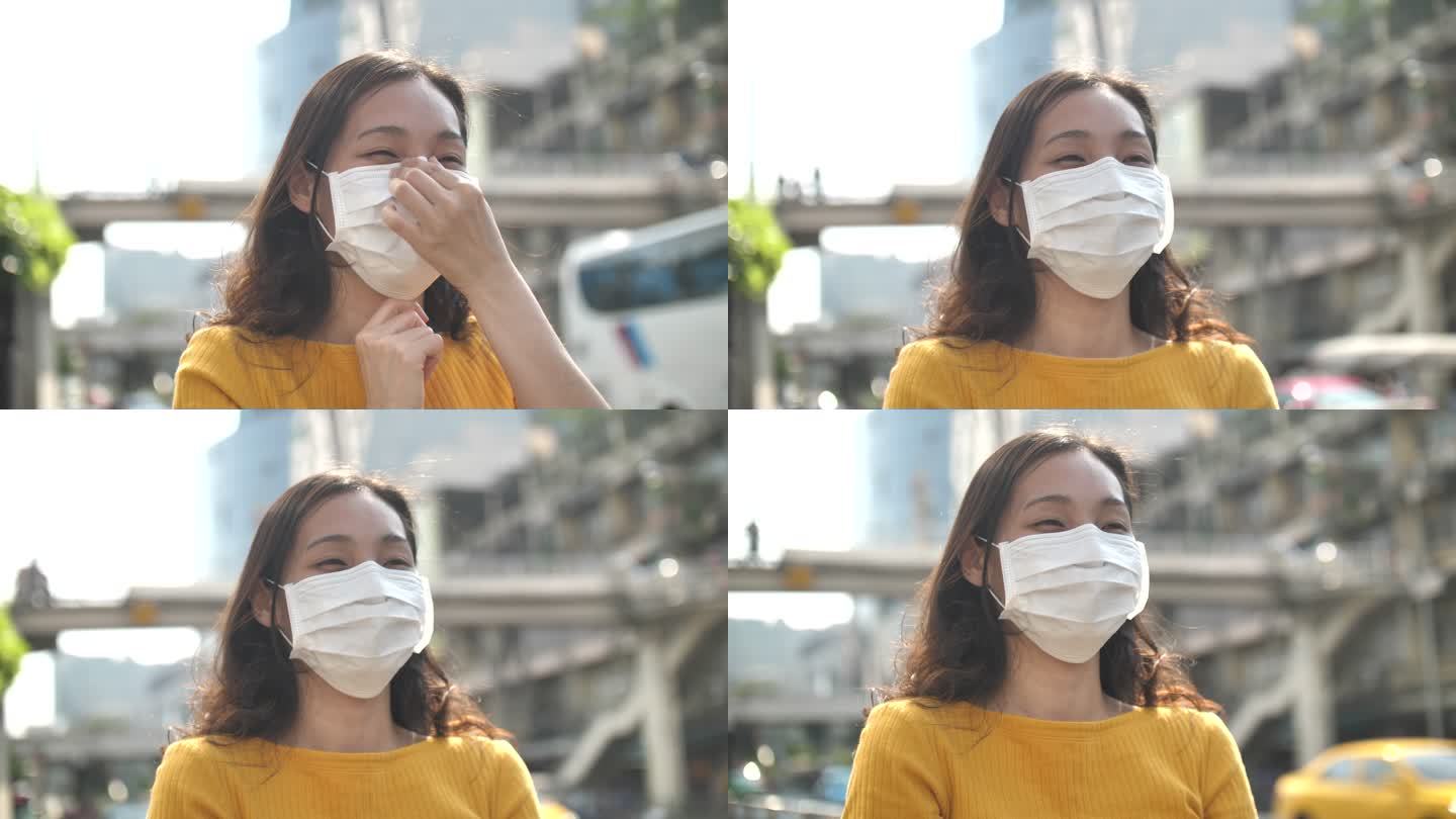 使用面部污染面膜的年轻亚洲女性