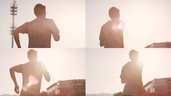 SLO MO日落时在体育场跑步的白人男子