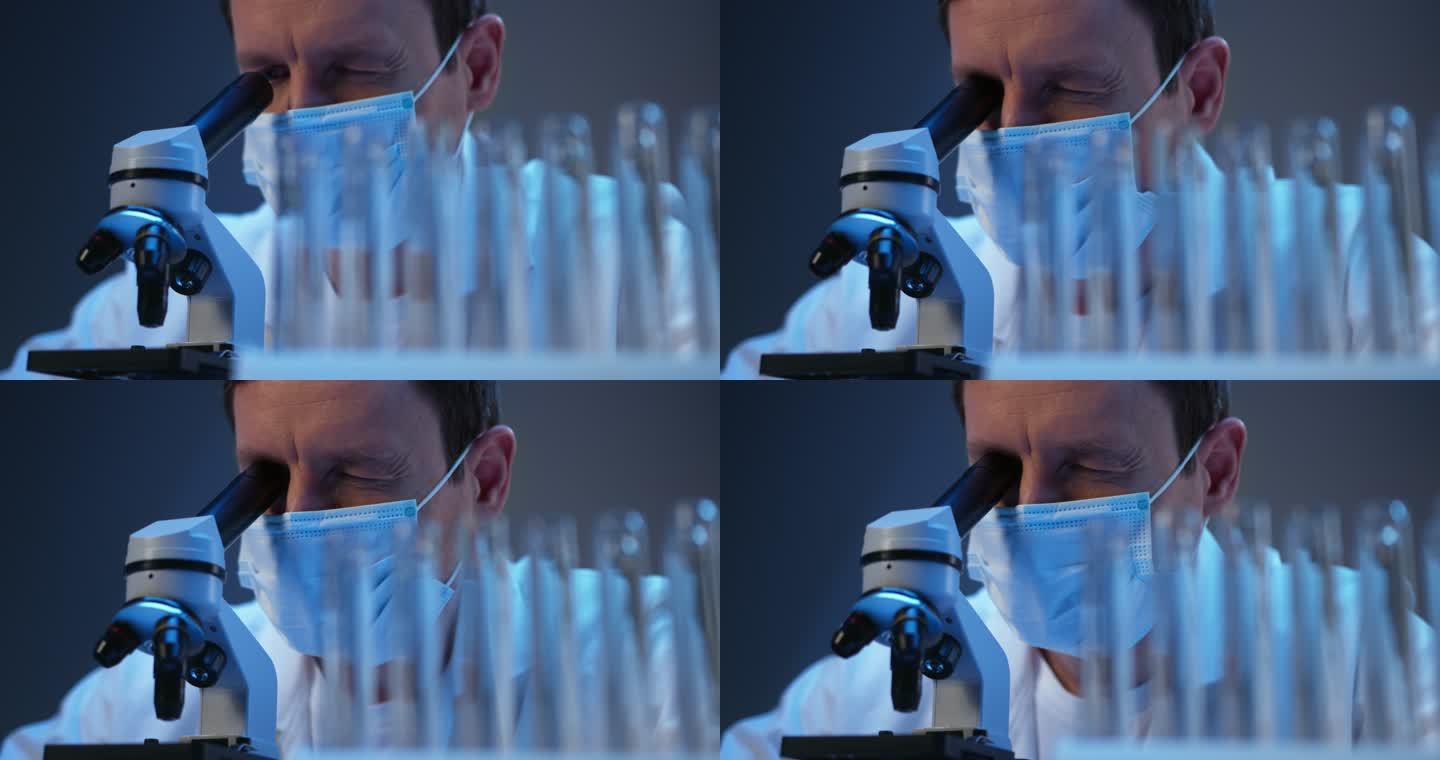 一位年轻科学家在现代实验室里用显微镜观察的特写镜头