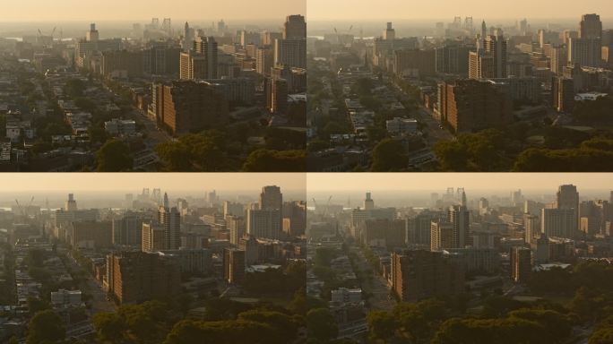 日出时分，弗兰克林敦、北部自由区和本杰明·富兰克林桥的住宅区和工业区全景鸟瞰图。无人机用摇摄相机的动