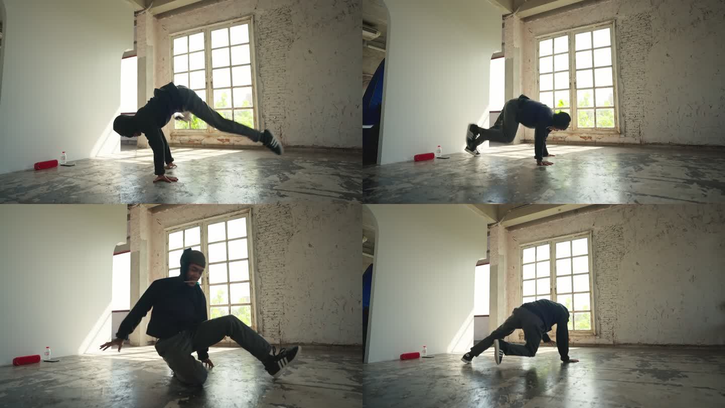 亚洲霹雳舞者男子练习街舞，Bboy独自在地板上播放喜爱的音乐，低角度观看