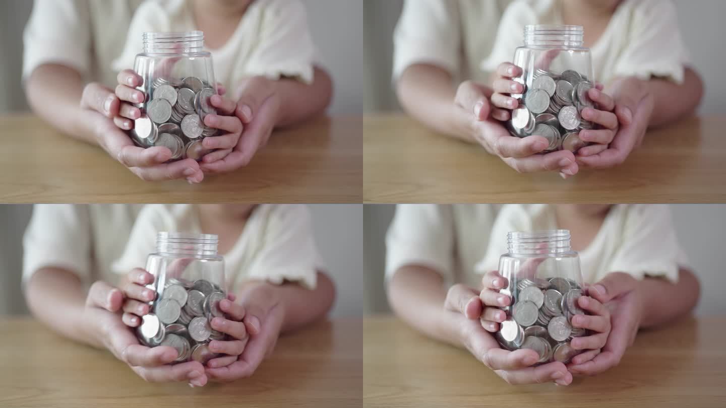 成人和儿童手拿一个装有硬币的罐子，慈善理念