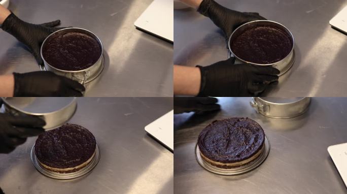 一个无法辨认的糖果商将蛋糕上的霉菌除去