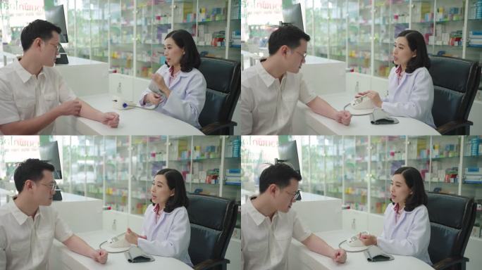 亚洲女药剂师正在对一名男性患者进行血压测量测试