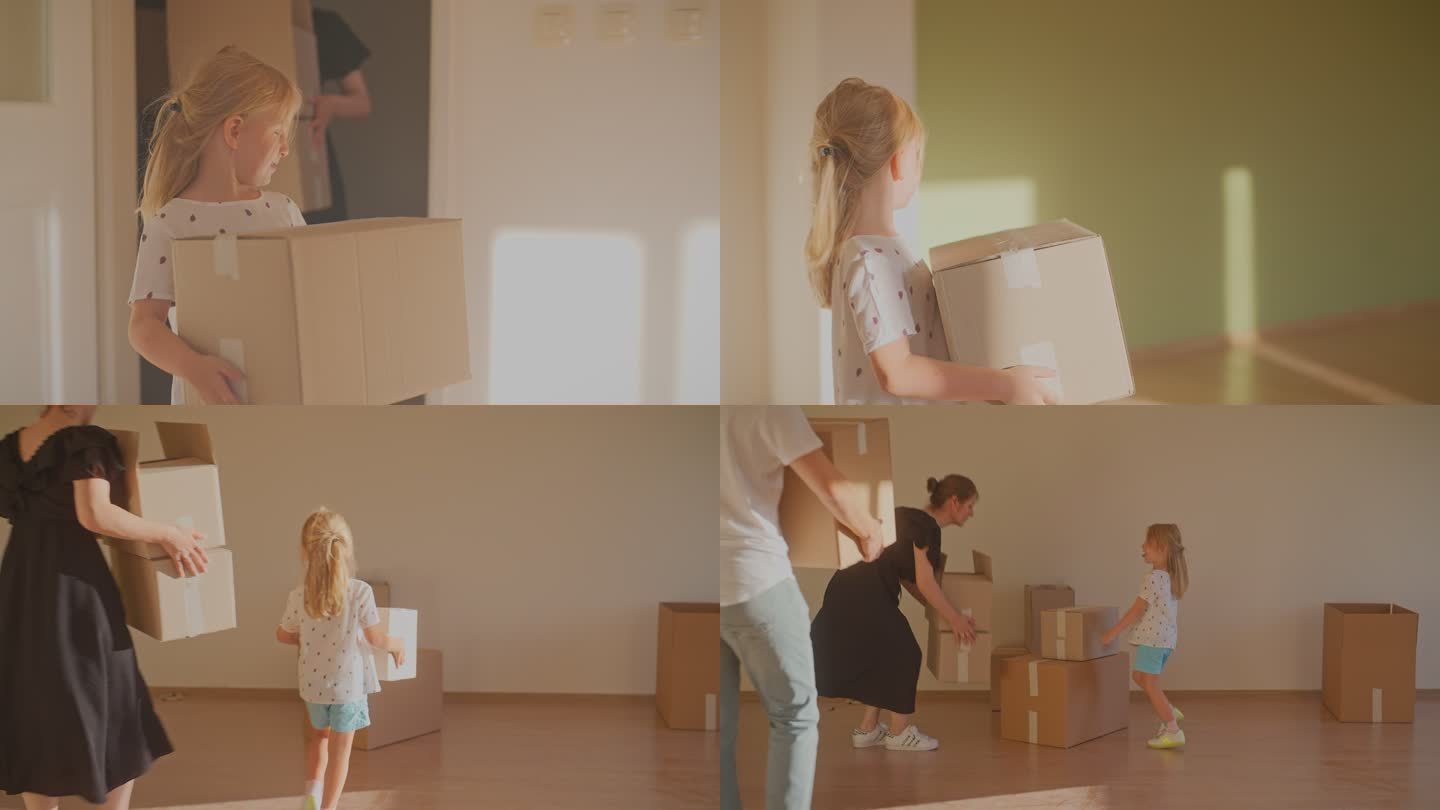 一个年轻的家庭和一个孩子把纸箱搬进他们的新房子