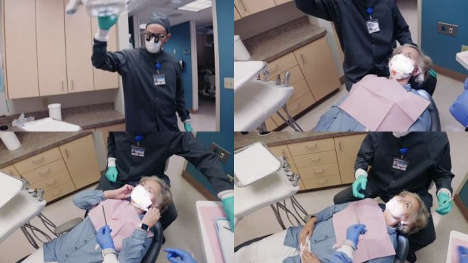 一位戴着N95口罩的男性牙医在一位60多岁的女性患者身上调整牙灯，这位患者躺在牙科诊所检查室的牙医椅