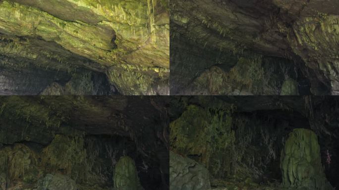 洞里很暗，隐约可以看到一些钟乳石的轮廓