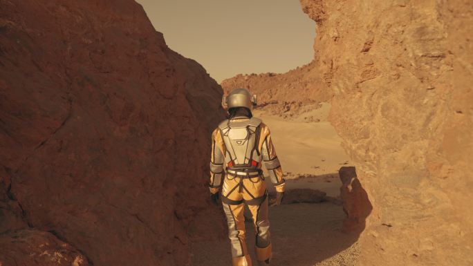 火星漫步。女宇航员探索铁锈色的洞穴和岩石。接触石墙