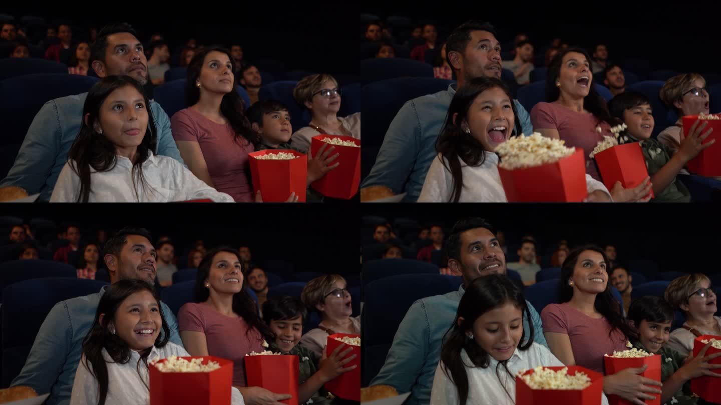 拉丁美洲家庭在电影院看恐怖电影