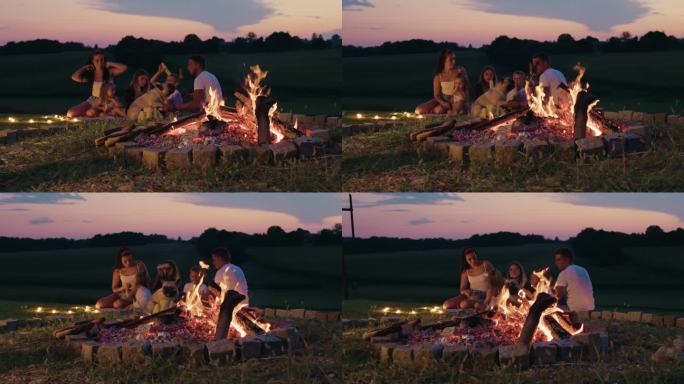 父母和孩子在篝火旁共度时光