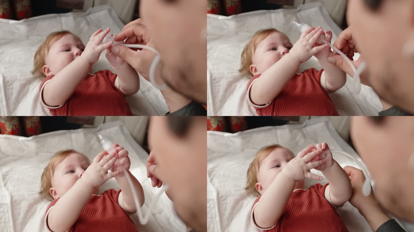 一名男子试图在家为他的女婴使用鼻吸器