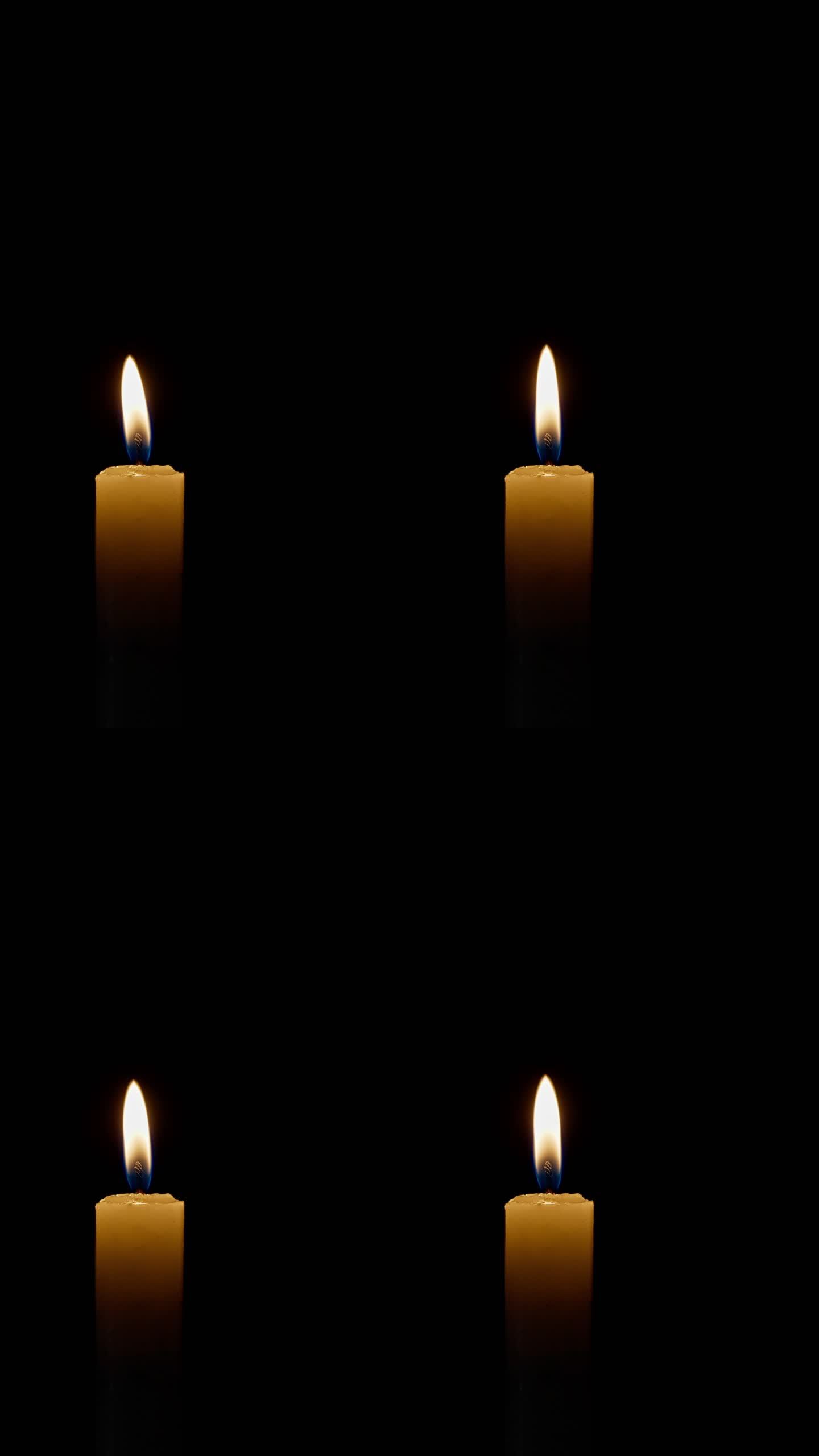 黑色背景蜡烛中的稳定单火焰