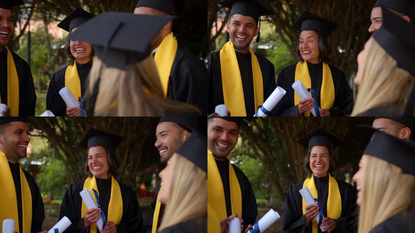 快乐的成年朋友们毕业了，他们都穿着毕业礼服，谈笑风生