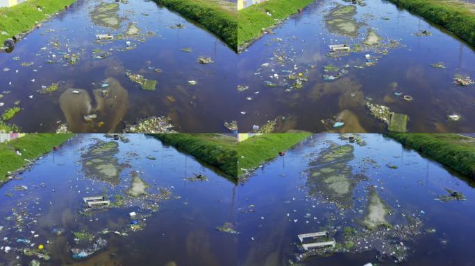 4k视频无人驾驶飞机拍摄的一条被污染的河流中充满了各种废物