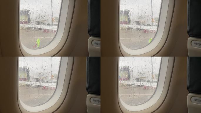 飞机窗户上的雨滴准备起飞了