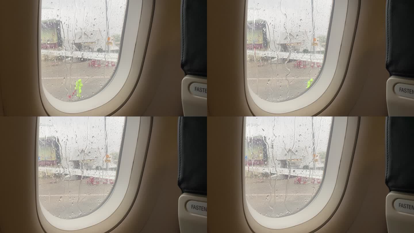 飞机窗户上的雨滴准备起飞了