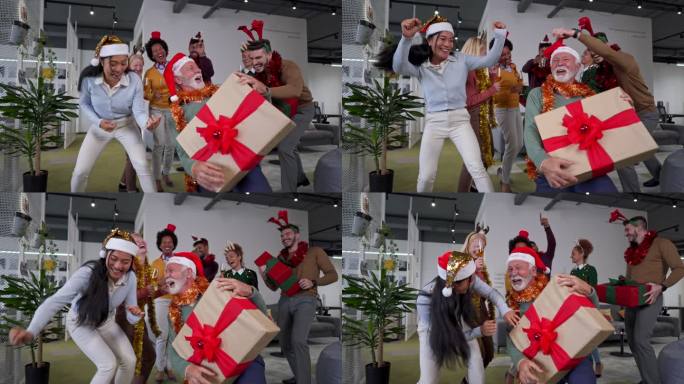 在高级男性首席执行官的带领下，一群多种族同事在办公室的圣诞派对上跳舞