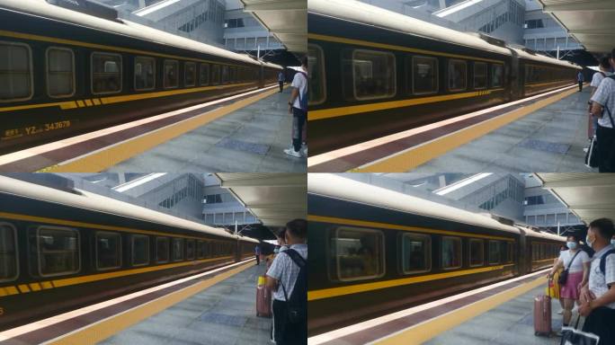 绿皮火车进站和旅客站台等待火车出行行李