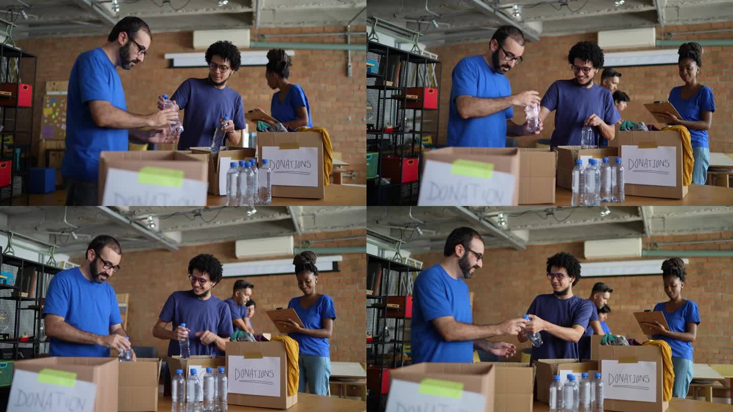 志愿者在慈善捐赠中心安排水瓶