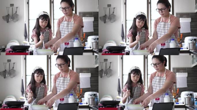 妈妈教女儿在厨房里做煎饼