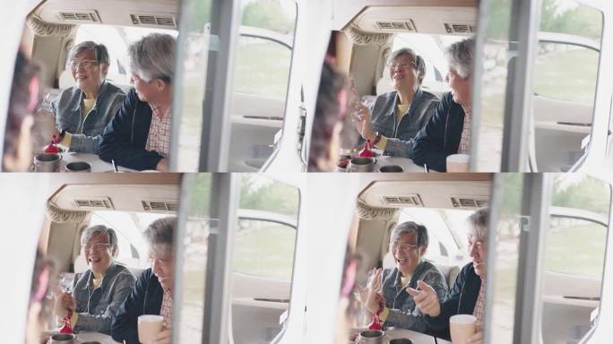 4位亚裔中国老年朋友在房车内享用早餐
