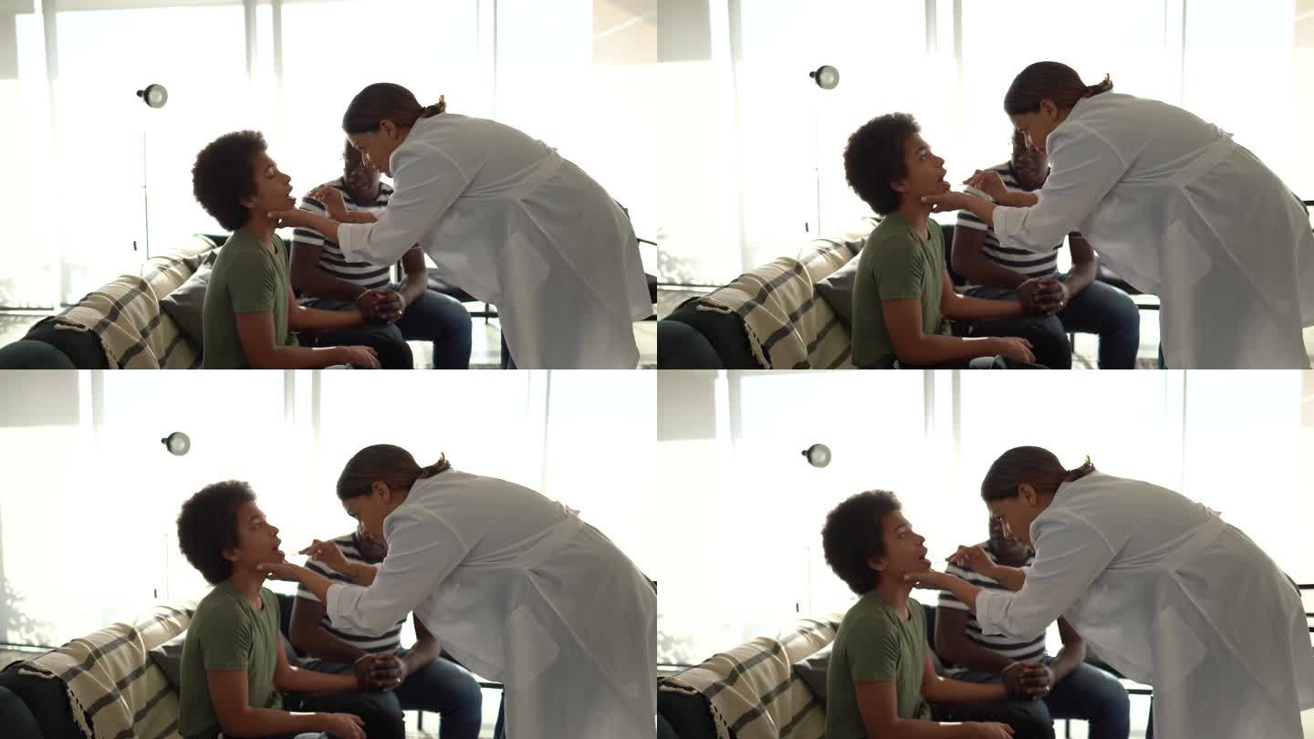医生在家检查男孩的喉咙