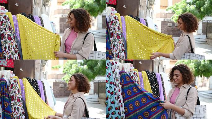 20多岁的沙特妇女在吉达Al-Balad购买布料